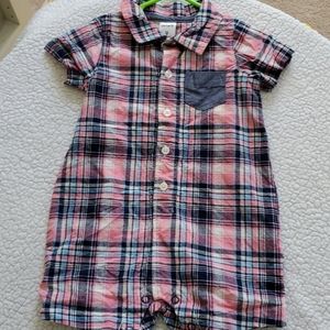 One piece button down short outfit.